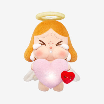 Plush toy with angelic design holding a heart and red heart-shaped object on a white background