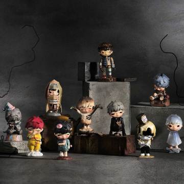 Collection of small figurines on a dark background