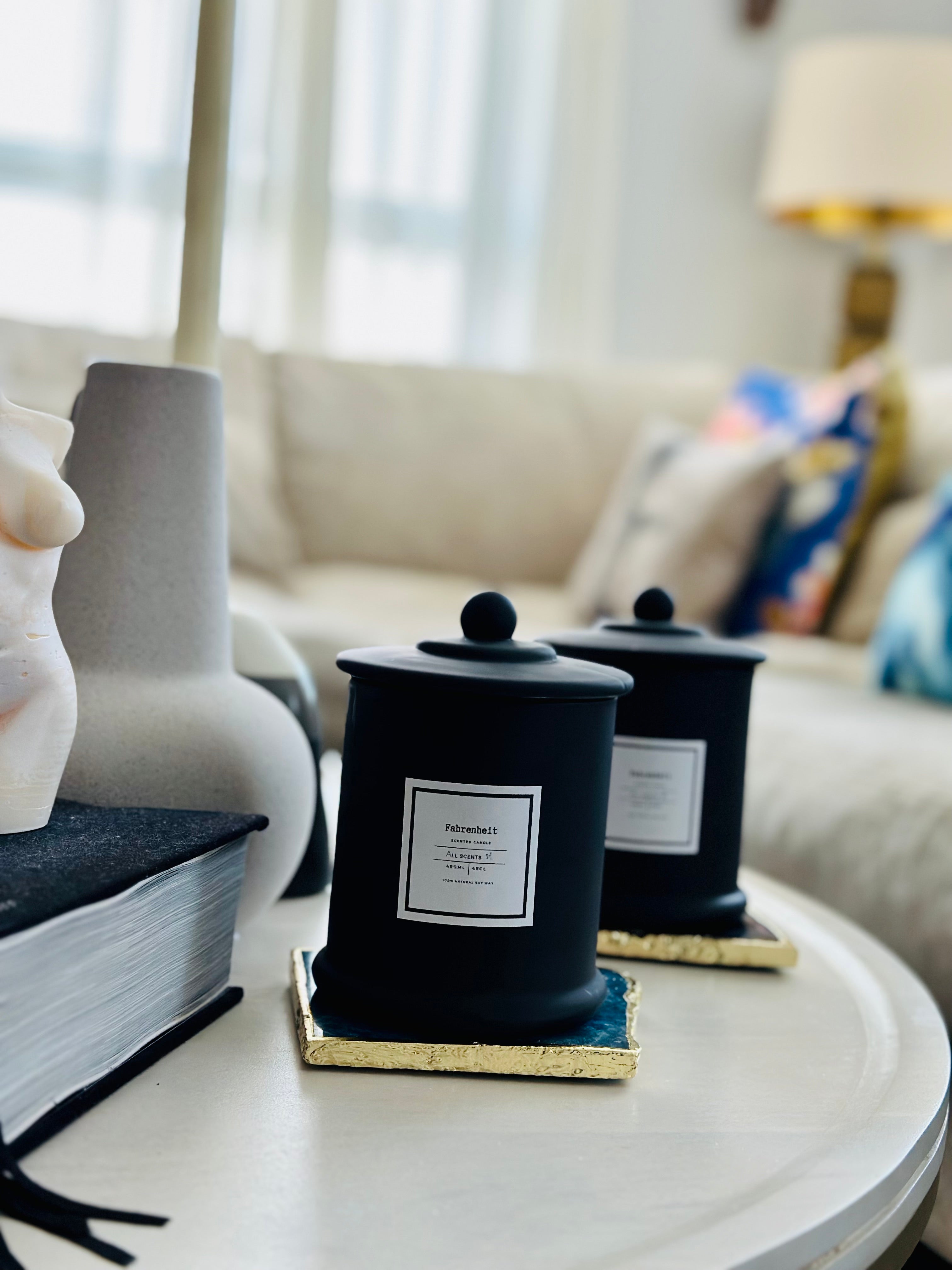 The Naomi luxury scented candle is a beautifully handcrafted black glass jar and a complimentary glass lid.