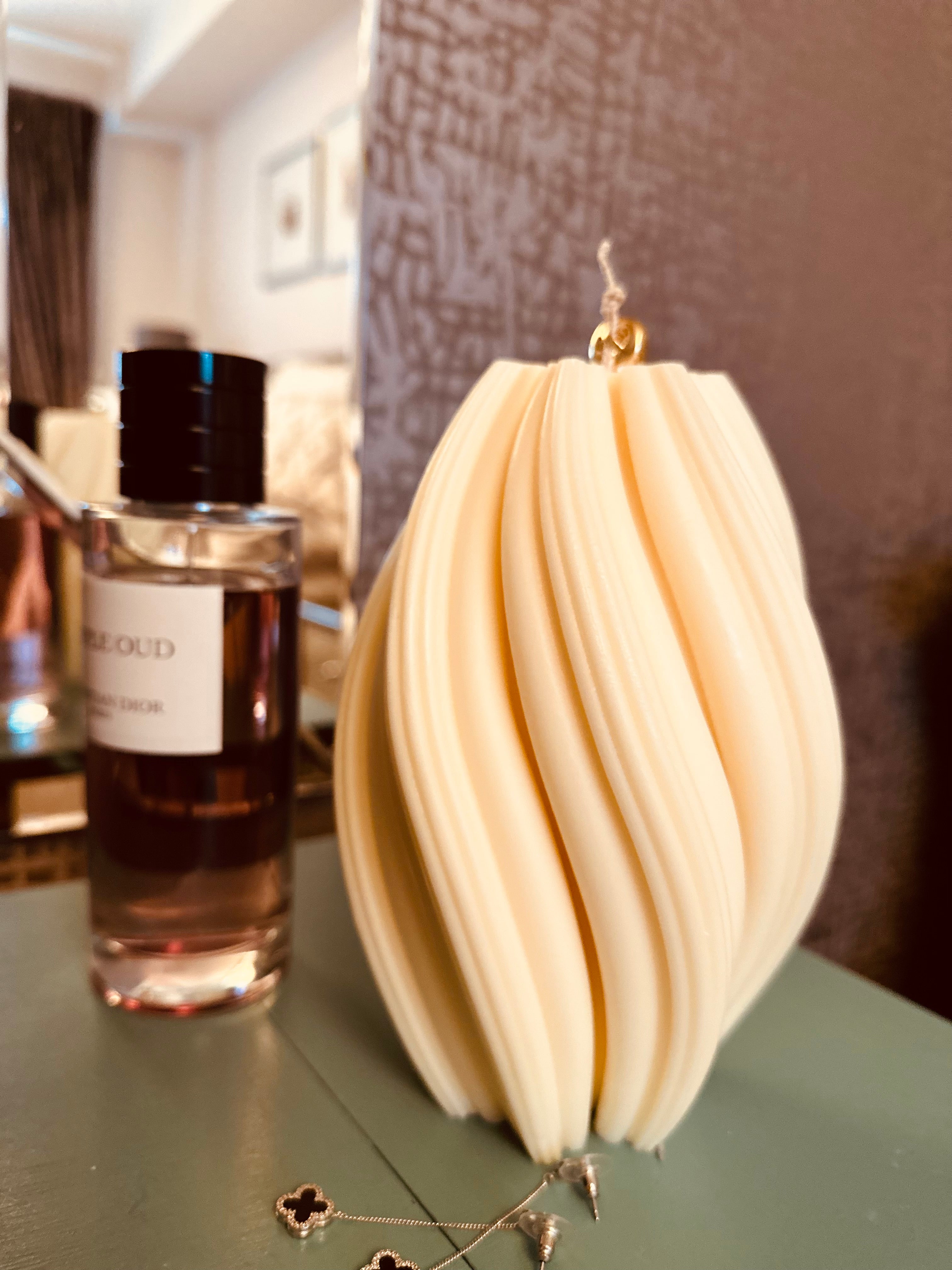 Introducing our captivating Extra Large Swirl Pillar Candle. The sweeping swirl design of this sculptural candle adds a touch of sophistication to your home