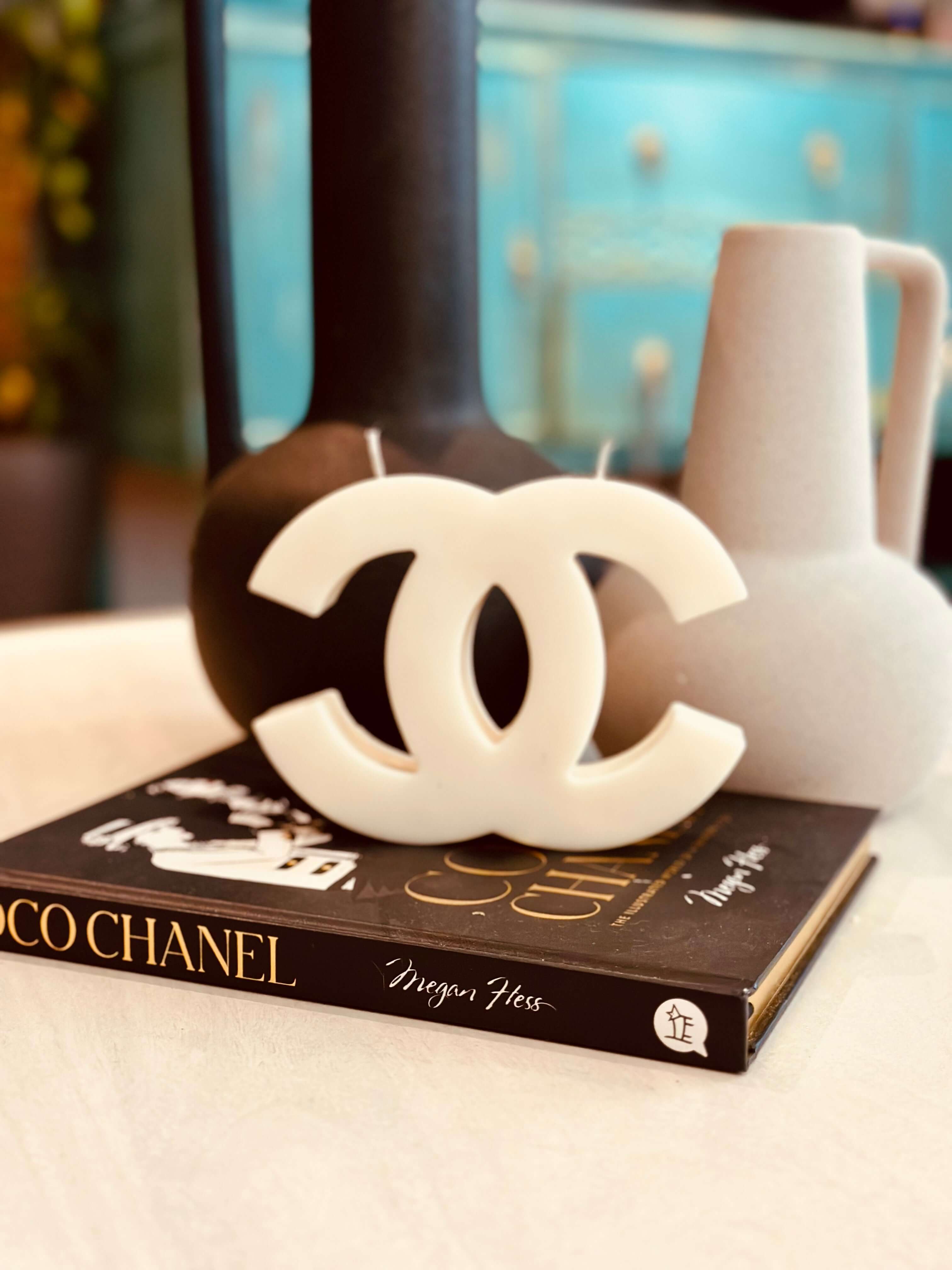 Experience the luxurious ambiance of our Inspired Designer Logo Candle. With its elegant logo design, this candle makes a stylish decor piece while filling your space with a rich and inviting fragrance. Made with premium materials, it's a perfect blend of style and relaxation.