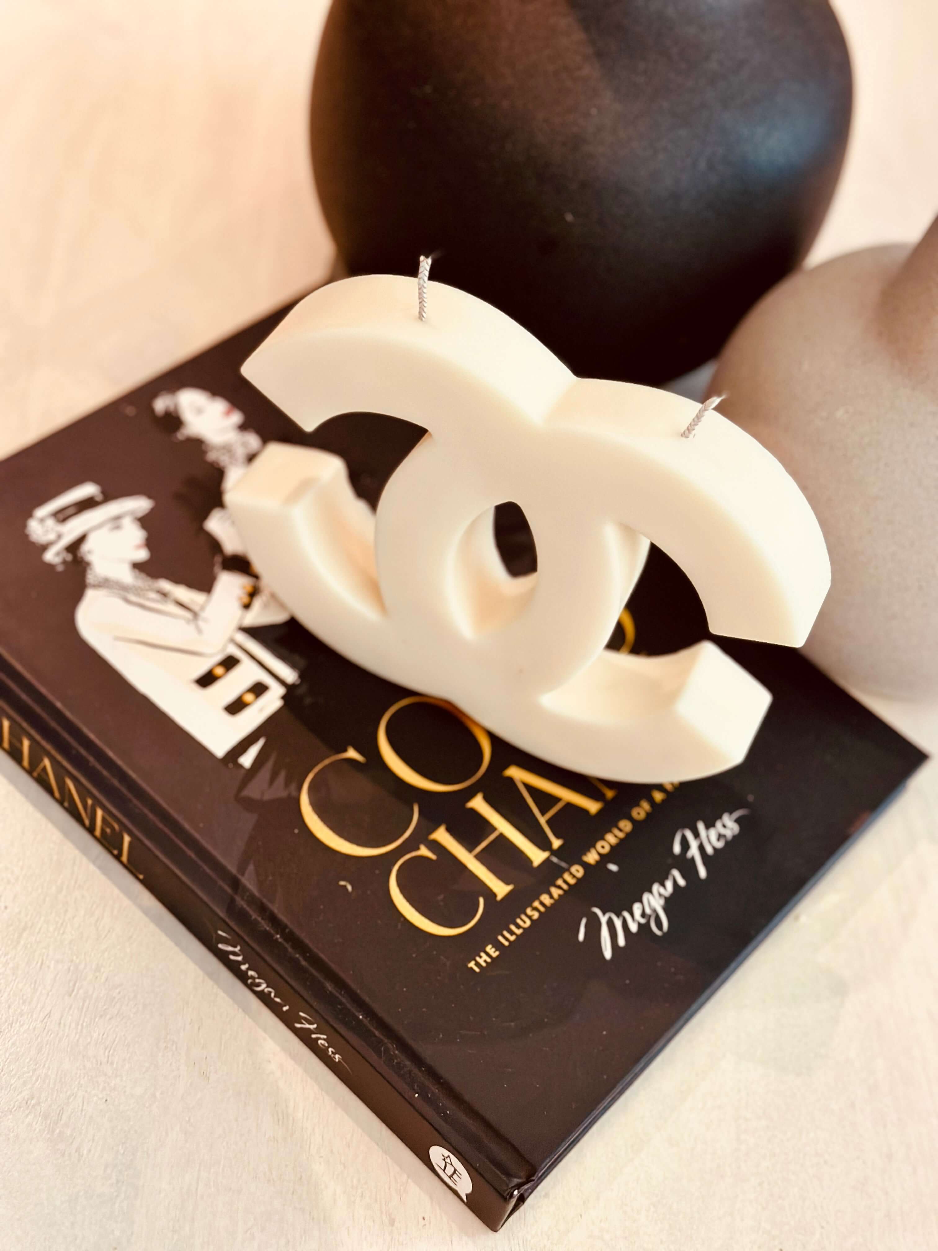 Experience the luxurious ambiance of our Inspired Designer Logo Candle. With its elegant logo design, this candle makes a stylish decor piece while filling your space with a rich and inviting fragrance. Made with premium materials, it's a perfect blend of style and relaxation.