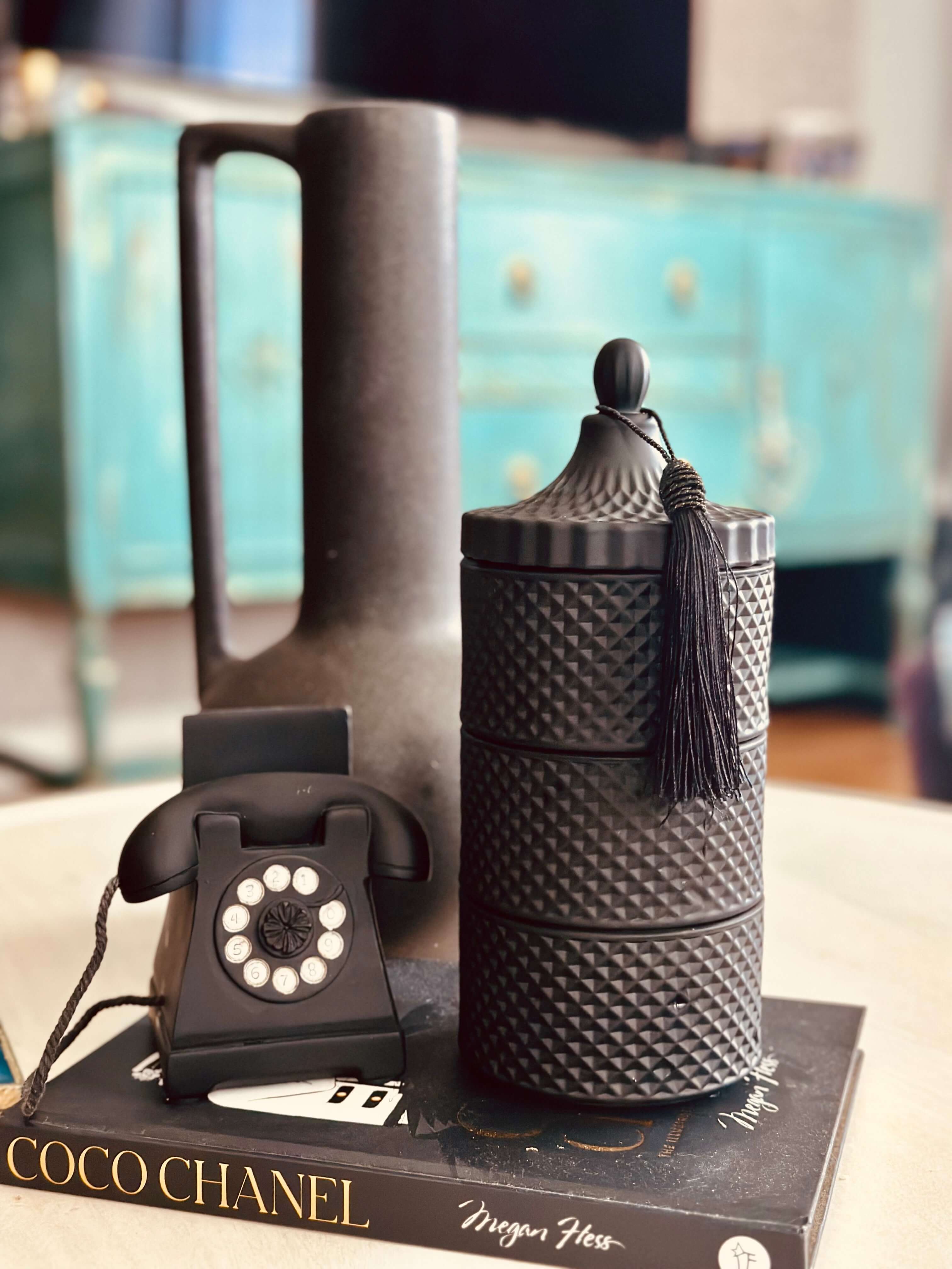 Experience the modern simplicity of our 3 Stackable Geo Candle Matte Black set. With its sleek geometric design, it adds a touch of elegance to any room. Each candle is hand-poured with 100% soy wax for a clean, long-lasting burn. Create a unique centrepiece or spread them throughout your home for a warm and inviting atmosphere.