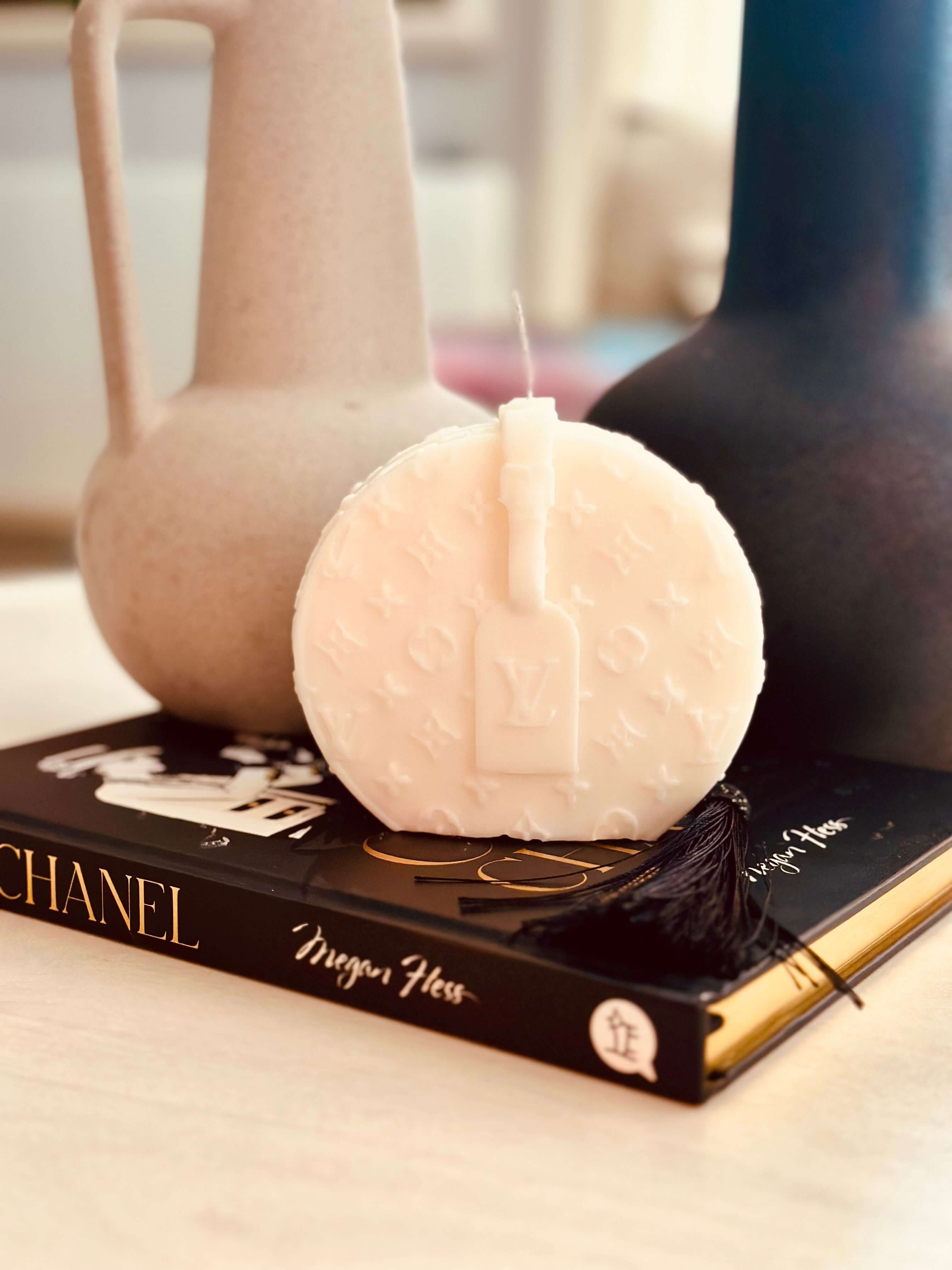 Expertly crafted and personalised, our Monogramed Sculptured Bag Candle, featuring the iconic LV design, adds a touch of elegance to any space. With its premium quality and stunning design, it is the perfect gift for yourself or a loved one. Elevate your home decor with this luxurious and unique candle.