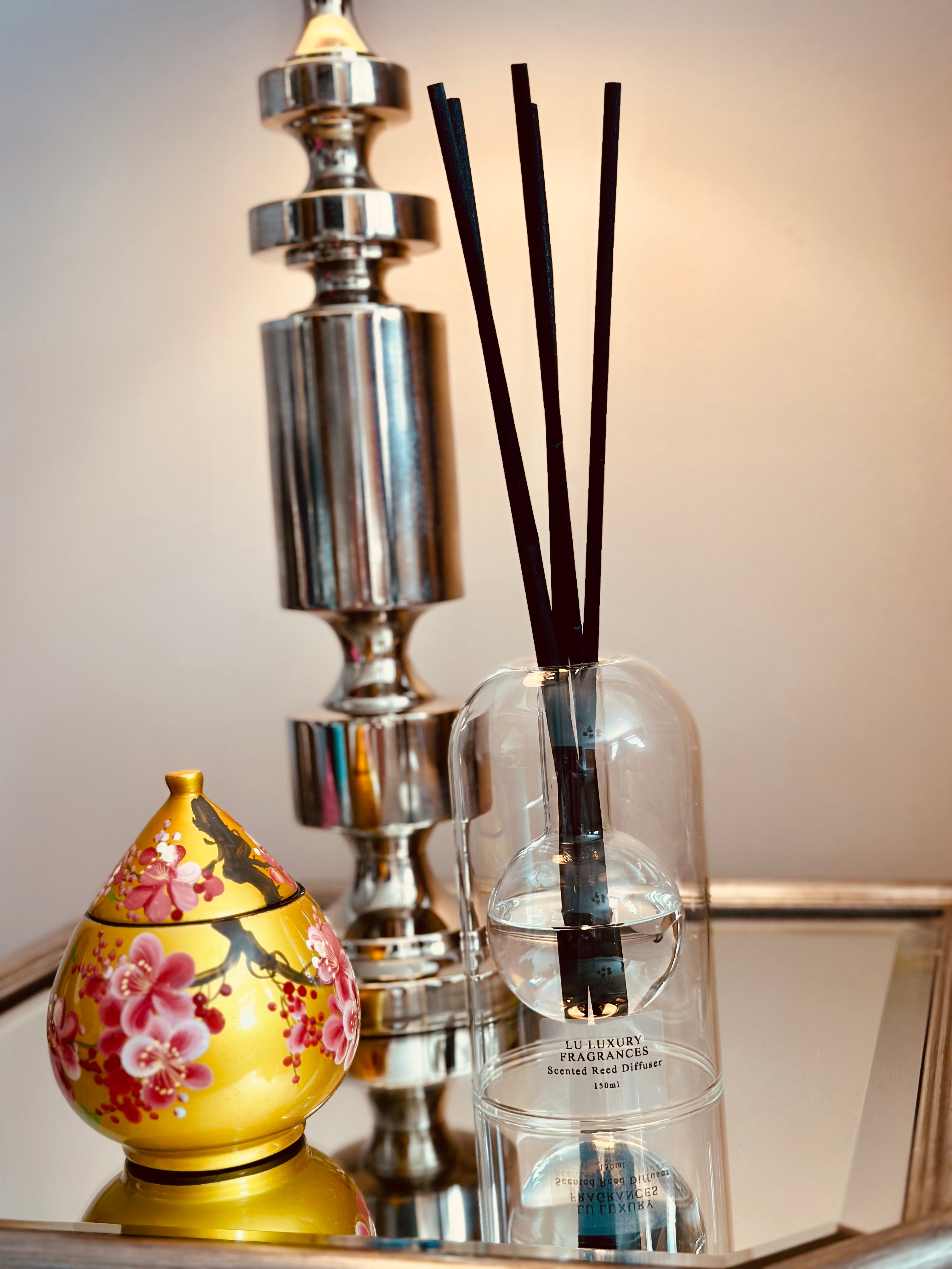 Designed with both elegance and innovation in mind, this Clear Glass Reed Diffuser boasts a sleek dome shape and built-in 120ml bottle for a seamless and sophisticated look.