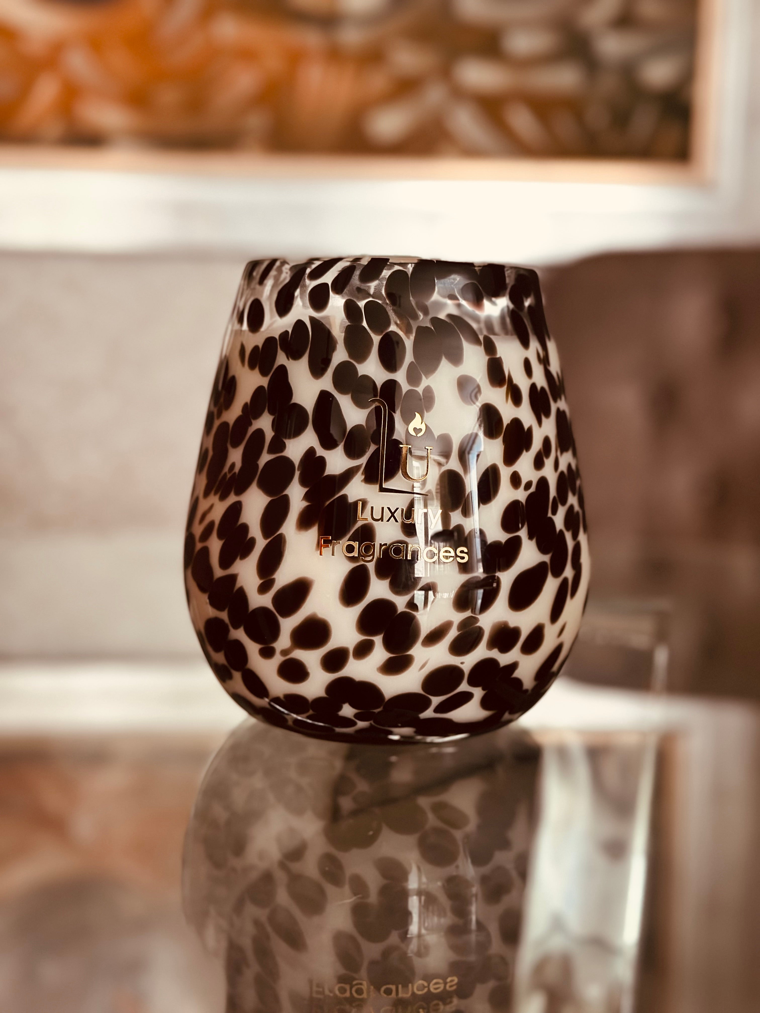 Our Jumbo Renee Glass Soy Candle in Cheetah print is a standout choice for upgrading your home decor. Crafted with a hand mould production process, our candle boasts a durable and secure jar, setting it apart from competitors. You can indulge in over 150 hours of natural, scented bliss with 1300g of wax and an array of fragrances, all while feeling good about using a vegan and cruelty-free product that is free of silicon and parabens.
