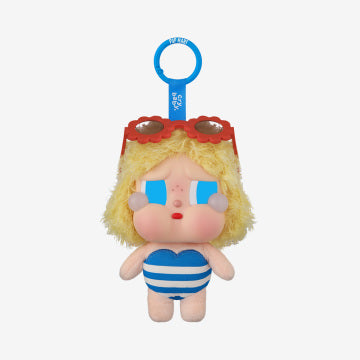 Plush toy with blonde hair, sunglasses, and a blue and white striped swimsuit on a white background.