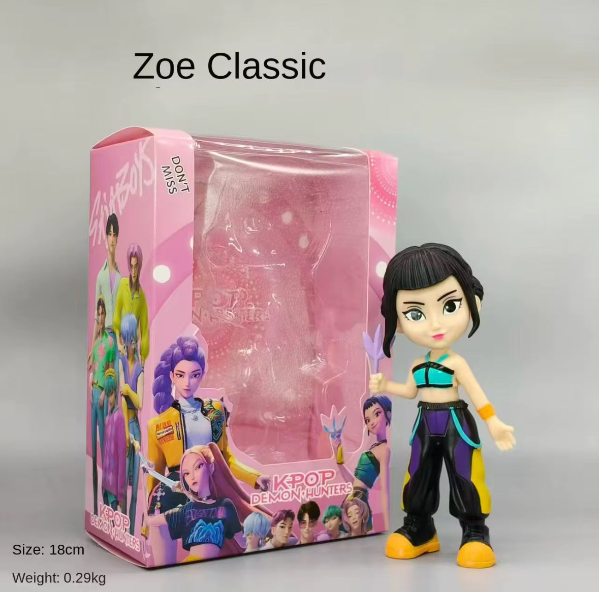 K-Pop colourful figure standing next to packaging.