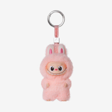 Pink fluffy keychain with a small face on a white background
