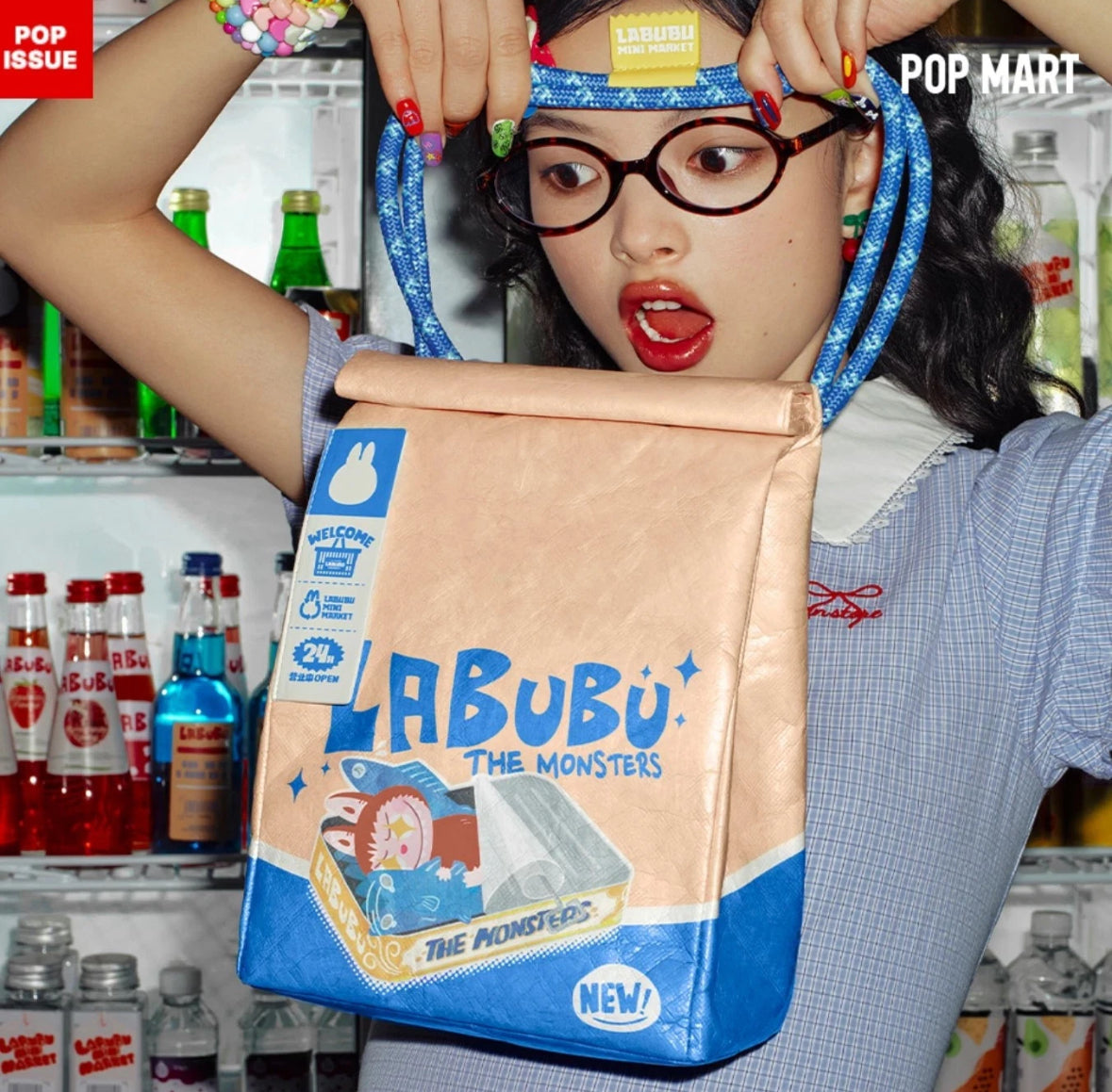 Person holding a 'Labubu' whacky mart messenger bag with a colourful background