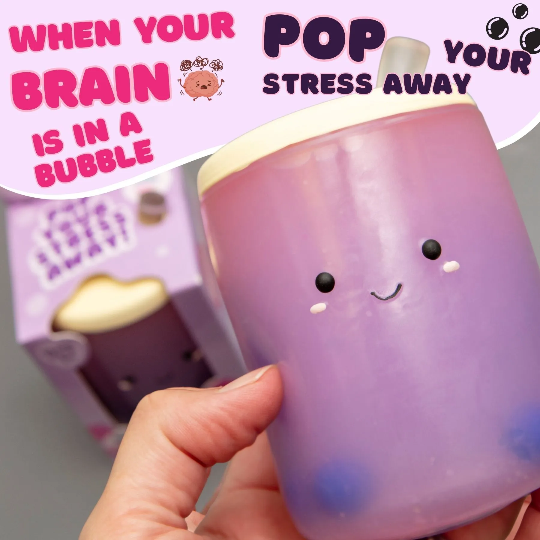 Hand holding purple boba bubble tea squishy stress toy