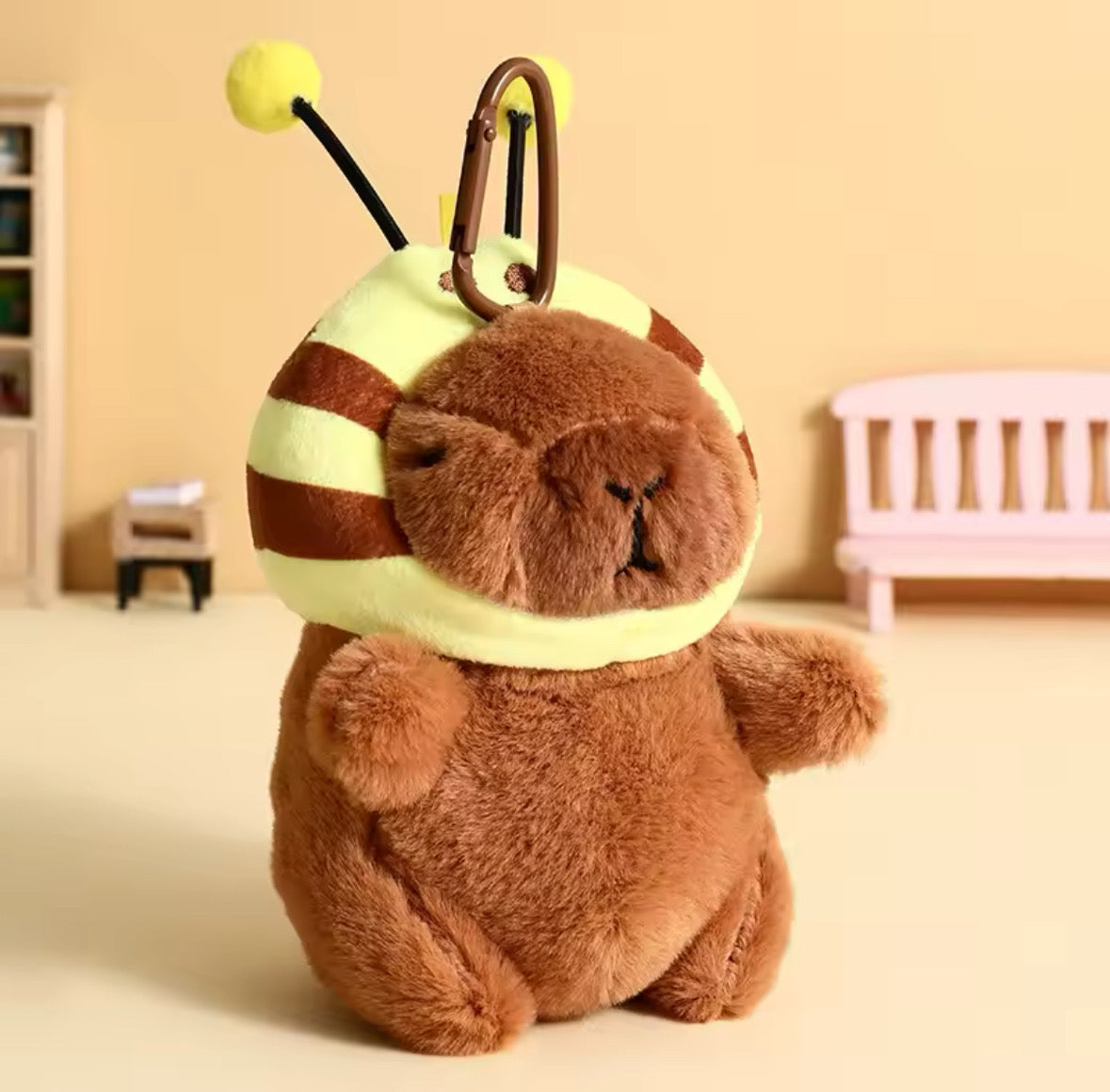 This cute Capybara has a detachable Bee Hat.