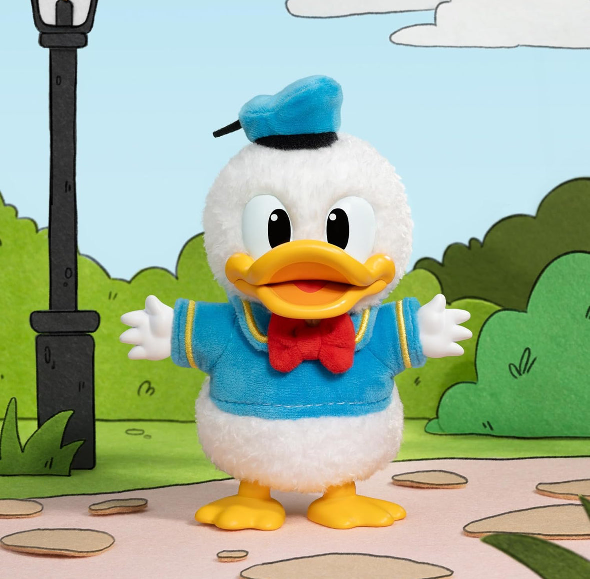 Plush toy of a cartoon character with a blue hat and jacket in a park setting