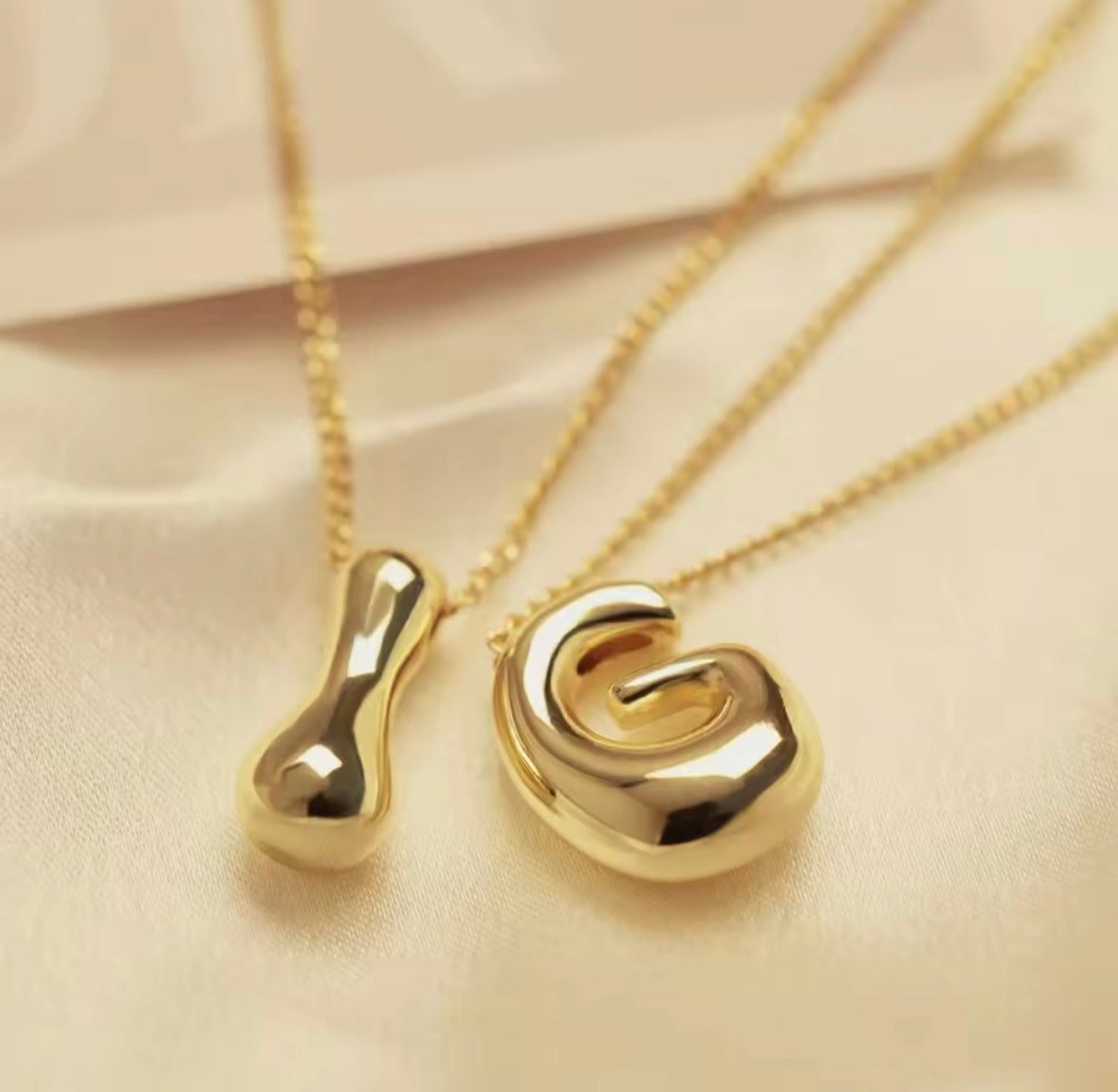 This elegant Gold-Plated Bubble Letter Monogram Necklace adds a personalised touch to any outfit.

Expertly crafted with a sleek gold-plated finish, this necklace features a bold and eye-catching monogram letter design. Elevate your style and stand out with this unique and sophisticated accessory.