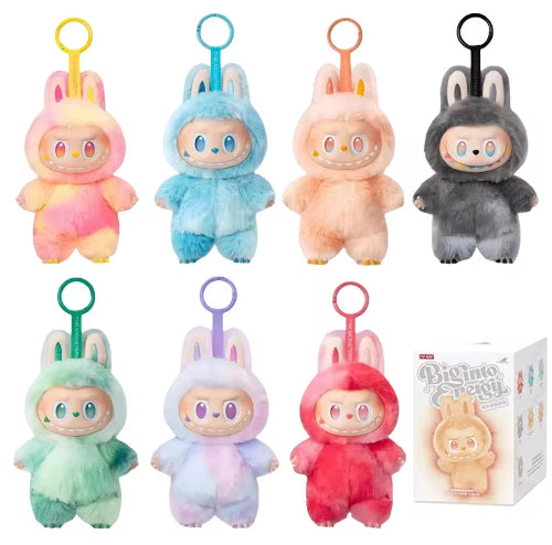 Set of colorful plush keychains with a box in the corner on a white background