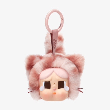 Plush keychain with cartoon face and pink hair on a white background