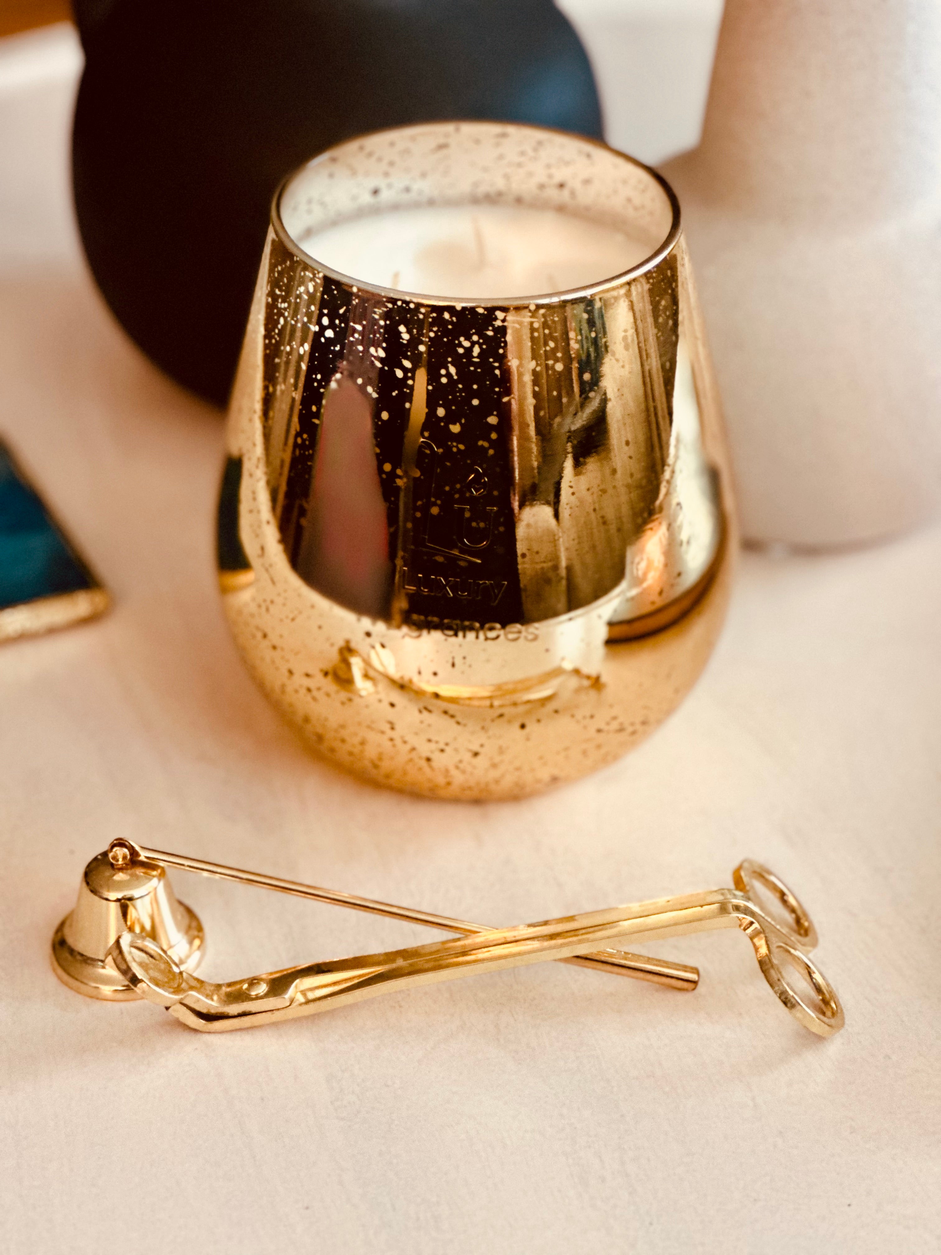 Jumbo Gold candle on a white table