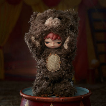 Stuffed animal-like character with a child's face on a colorful background