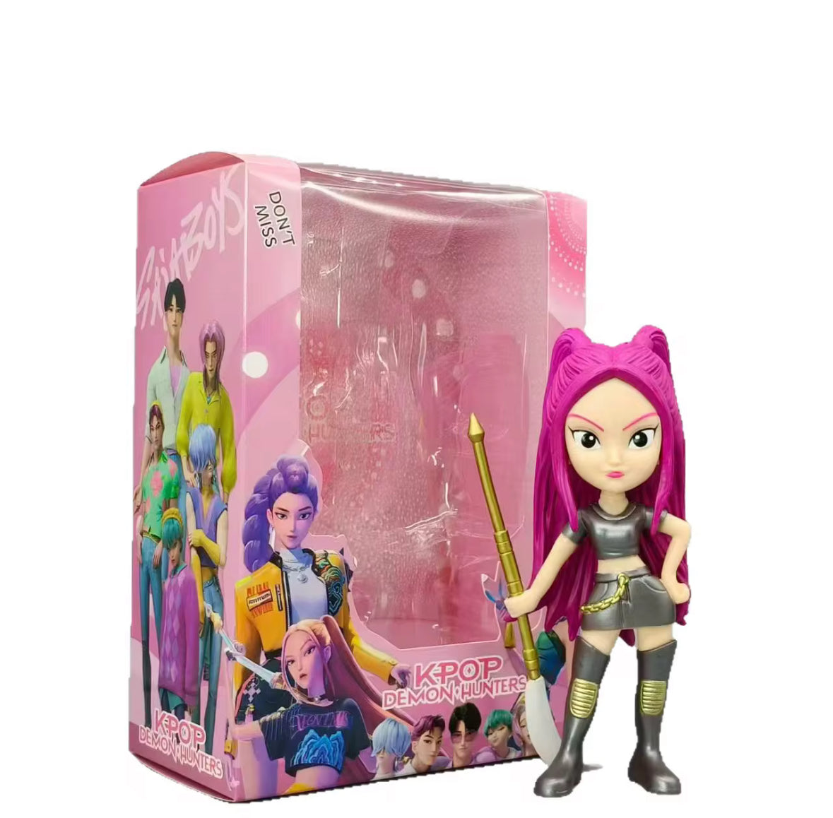 Colourful figure with metalic outfit standing beside box on a white background.