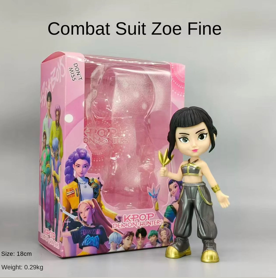 Toy figure of a character in a 'metallic Suit  with packaging on a grey background