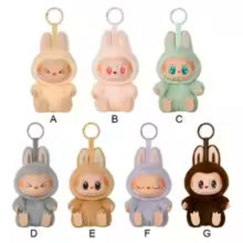 A collection of plush toy figures from the Labubu series, featuring various colors and designs, displayed in a blind box packaging.