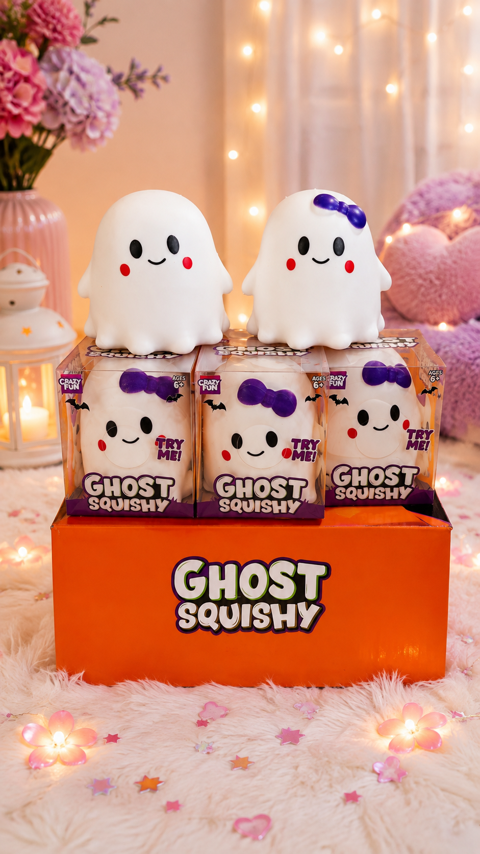 Crazy Fun Ghost Squishy Boy and Girl styles displayed together in orange Ghost Squishy retail box with fairy lights and floral background

