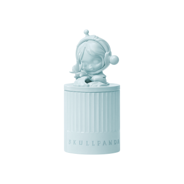 Light blue cylindrical candle with a panda figurine on top, featuring the brand 'SKULLPANDA'.